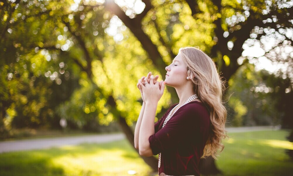 grateful woman practicing manifestation techniques