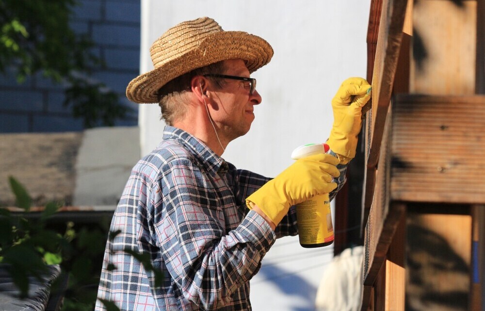 man fixing shed