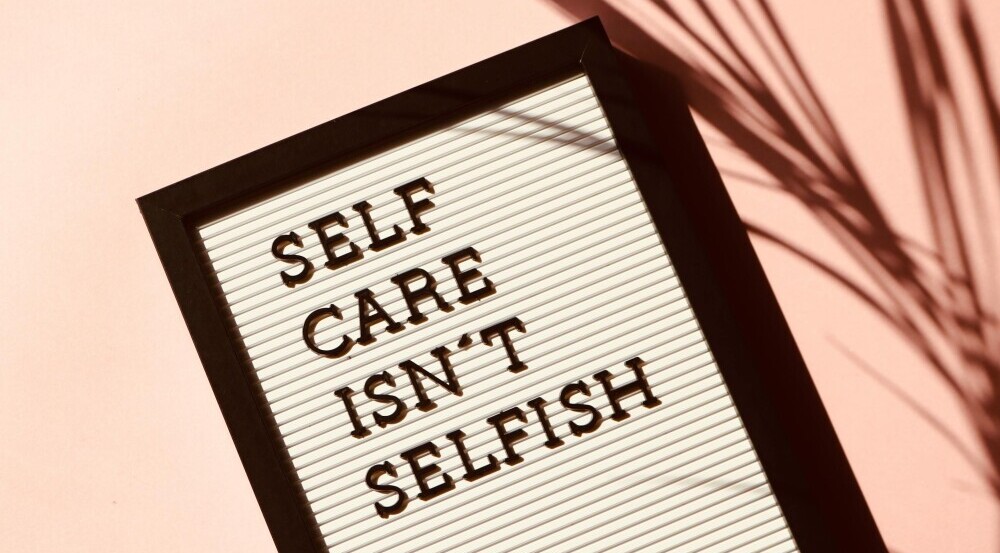 self care isn't selfish sign