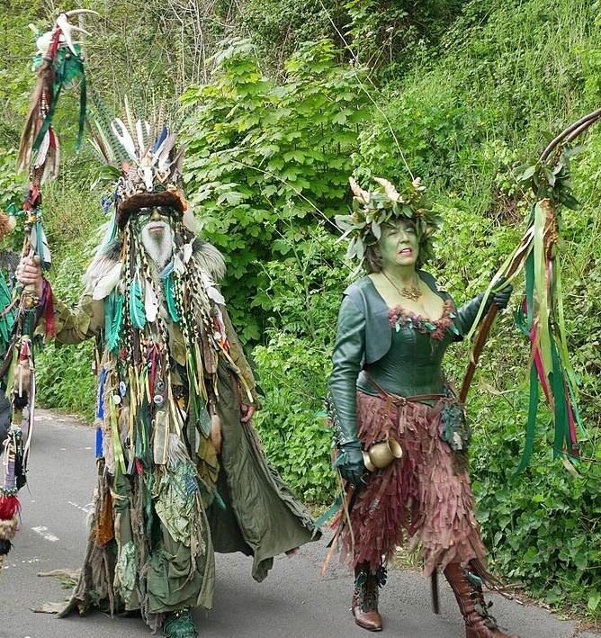 People dressed up as the Green Man and May Queen