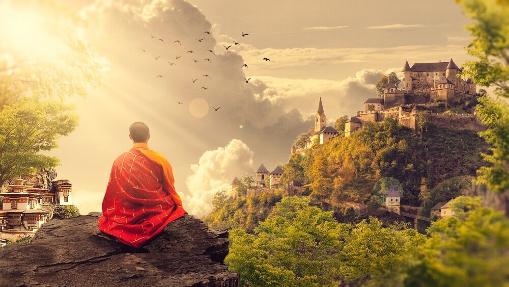a monk looking at a landscape representing dreams across cultures