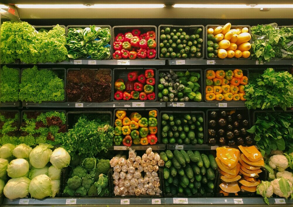 shelves of fresh food showing how to live more consciously by eating fresh food