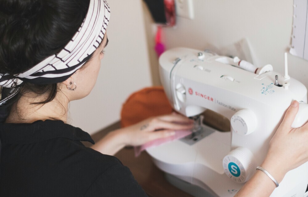 woman using a sewing machine