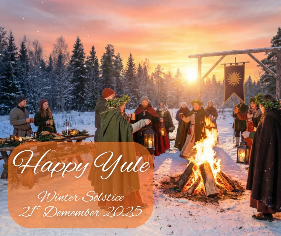 People around a campfire celebrating Yule with a sunrise in the background. 